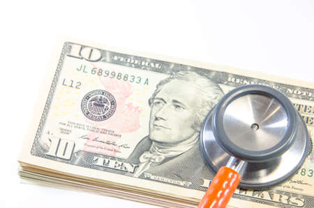 Medical still life with stethoscope, money, Isolated.の写真素材