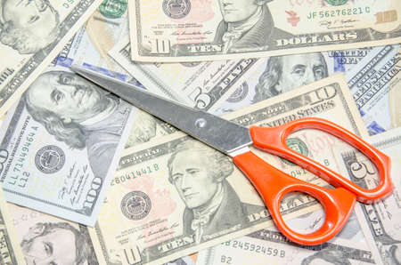 scissors cutting dollarの写真素材