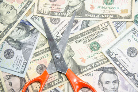 scissors cutting dollarの写真素材
