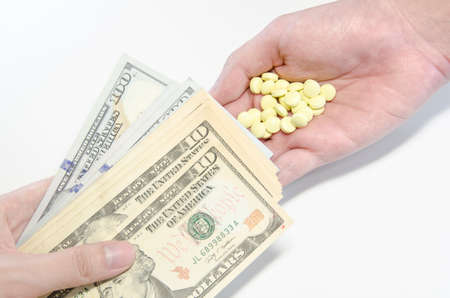 hands giving money to buy healthの写真素材