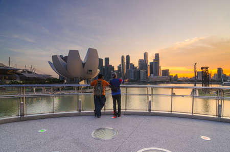 SINGAPORE, SINGAPORE - MAY 13: The skyline of Singapore lit up at night with the ArtScience Museum in the foreground. Photo taken May 13, 2014 in Singapore, Singapore.のeditorial素材