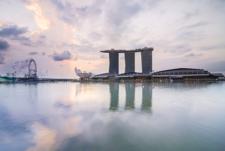 SINGAPORE -May 13: Wonderful sunrise at the Marina Bay waterfront in Singapore. Marina Bay Sands Hotel dominates the skyline at Marina Bay on May 13, 2014.のeditorial素材