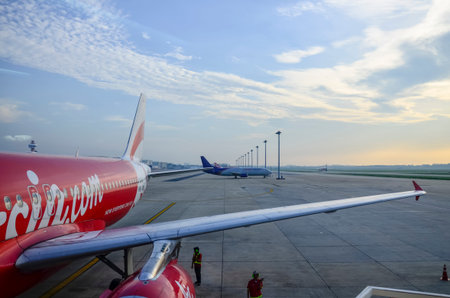 BANGKOK - MAY 8: AirAsia's aircrafts at Dong Muang Airport, Bangkok, Thailand on May 8, 2014. AirAsia is Asia's largest low-cost carrier, no-frills airline and a pioneer of low-cost travel in Asia.のeditorial素材