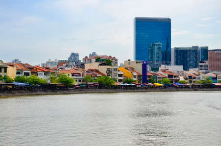 SINGAPORE-May 13: Business district and Boat Quay on May 13, 2014 in Singapore. Central Business District (CBD), located at south of Singapore River.のeditorial素材