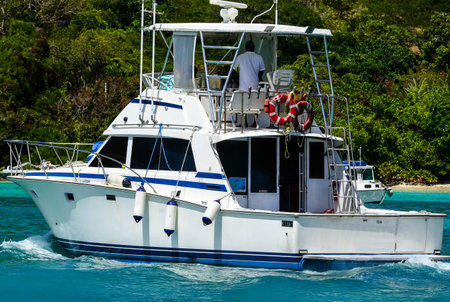 Charter fishing boat in British Virgin Islands heading in to pick up fishermenの写真素材