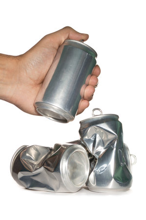 Hand with dented cans on white background