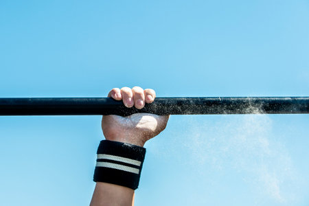 Man, strong male, athlete performs sport exercise, fitness street workout. Healthy Lifestyle....