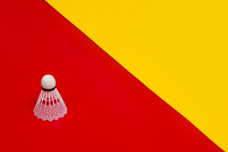 Badminton shuttlecock against a red and yellow  backgroundの写真素材
