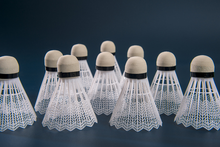 Badminton shuttlecock against a blue backgroundの写真素材