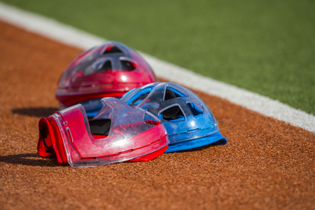 Field hockey equipment on green grassの写真素材