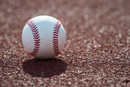new baseball ball on red track rubberの写真素材