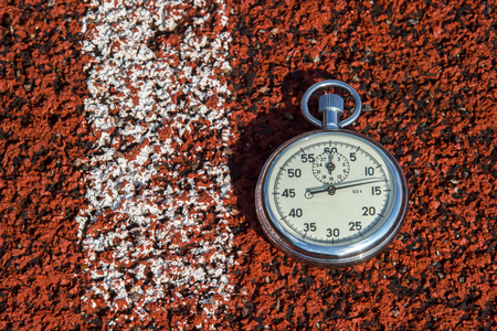 old sport stopwatch on running track rubberの写真素材