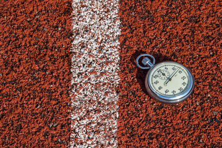 old sport stopwatch on running track rubberの写真素材