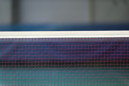Badminton net indoor on badminton court, closeup view of badminton net with blurry backgroundの写真素材