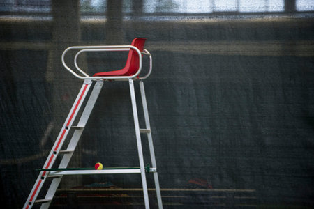 chair referee on gray wall . Tennis game.の写真素材