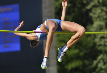 young woman in highjump,track and fieldの写真素材