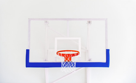 Basketball hoop cage, isolated large backboard closeup, new outdoor court set, blue, red, orange, white back board blank copy space backgroundの写真素材