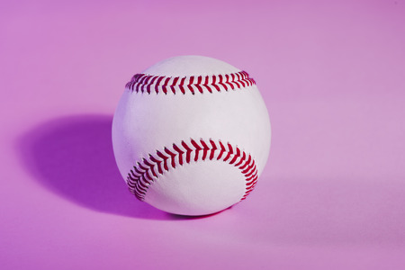 baseball on a Pink color background and red stitching baseball. copy space.の写真素材