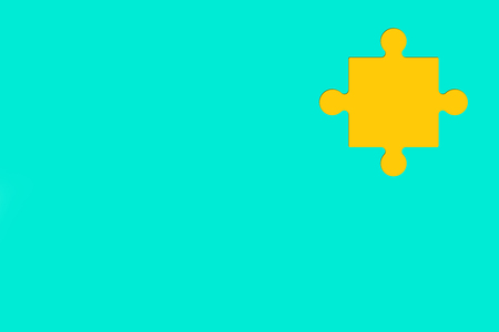 Yellow Puzzle piece on blue background as symbol of autismの写真素材