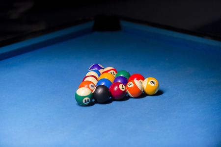 Billiard balls on pool blue table - sport backgroundの写真素材
