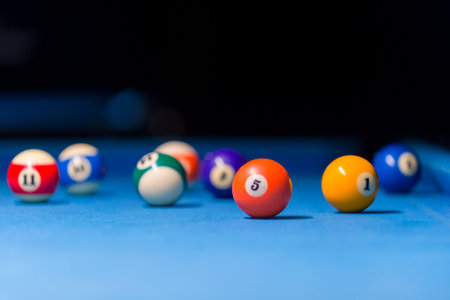 Billiard balls on pool blue table - sport background