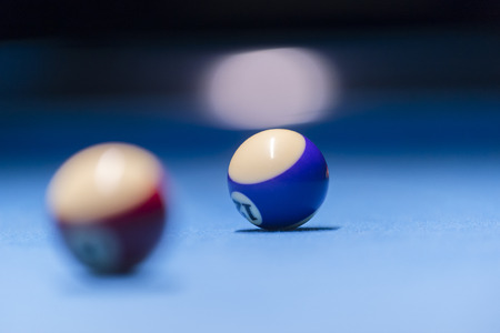 Colorful billiards balls. Billiard ball at blue table. Colorful American pool snooker balls background. American Billiard in bar. Close up Billiard balls. Bar game. Billiard table game.の写真素材