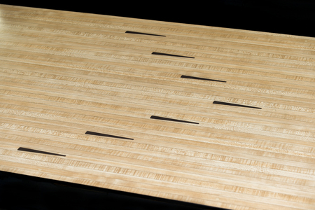 Parquet wood floor black arrows of bowling sportの写真素材