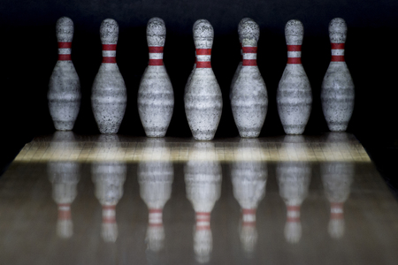 Ten pin bowling alley background. Closeup of tenpin row on a lane, night lightの写真素材