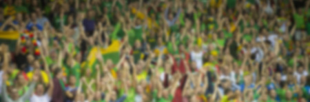 Blurred crowd of spectators on a stadium tribune at a sporting eventの写真素材
