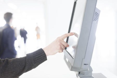 hand presses on screen digital tabletの写真素材