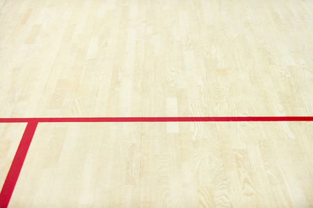wooden floor volleyball, basketball, badminton, futsal, handball court with light effect Wooden floor of sports hall with marking lines line on wooden floor indoor, gym courtの写真素材