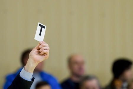 Referee shows card during table tennis matchの写真素材