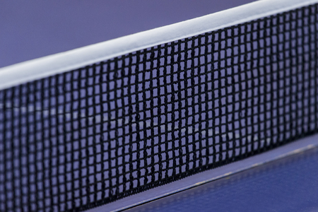 Net on blue ping pong tennis tableの写真素材