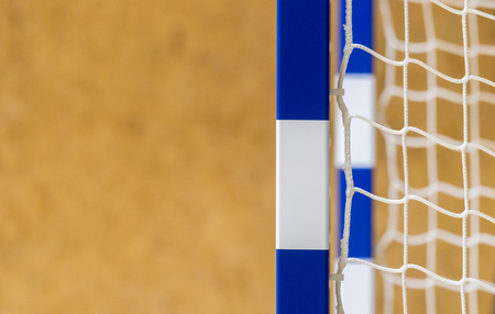 Gate for futsal or handball in gym. Detail of gate frame and net. Outdoor football or handball playgroundの写真素材