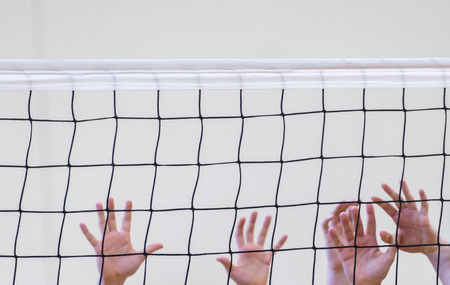 volleyball net with man handsの写真素材