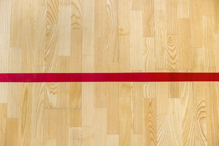 Red line on the gymnasium floor for assign sports court. Badminton, Futsal, Volleyball and Basketball courtの写真素材