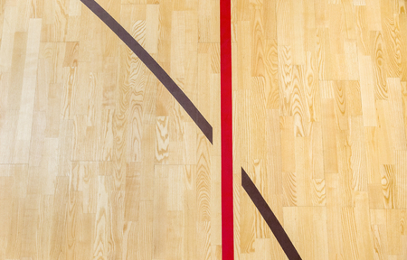 wooden floor badminton, futsal, handball, volleyball, football, soccer court. Wooden floor of sports hall with marking red lines on wooden floor indoor, gym courtの写真素材