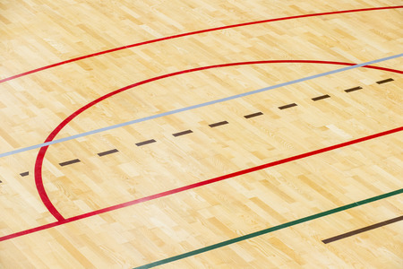 wooden floor badminton, futsal, handball, volleyball, football, soccer court. Wooden floor of sports hall with marking red lines on wooden floor indoor, gym courtの写真素材