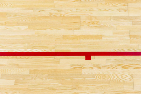Red line on the gymnasium floor for assign sports court. Badminton, Futsal, Volleyball and Basketball courtの写真素材