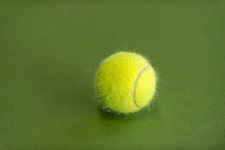tennis ball on a tennis courtの写真素材