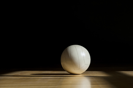 Volleyball court wooden floor with ball isolated on black with copy-spaceの写真素材