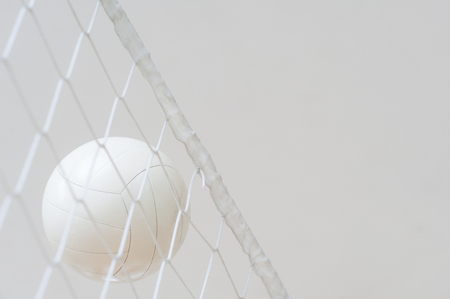 Volleyball ball over the net during match の写真素材