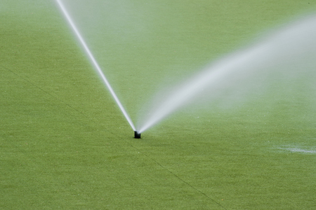 Irrigation System Watering the green lawn. Green grass. Soccer gameの写真素材