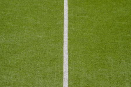 Artificial green turf texture background with white line marksの写真素材