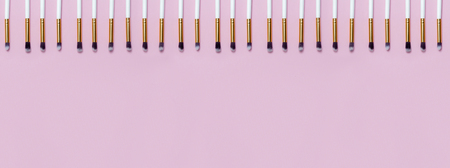 Set of makeup brushes on pink background. Top view point, flat lay. Top viewの写真素材