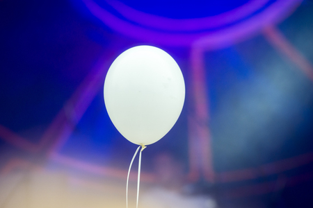 Blank White Helium Balloon on a white String Floating in Mid Airの写真素材