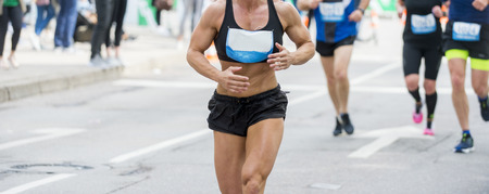 Unrecognizable muscular runner outdoors. Long distance runningの写真素材