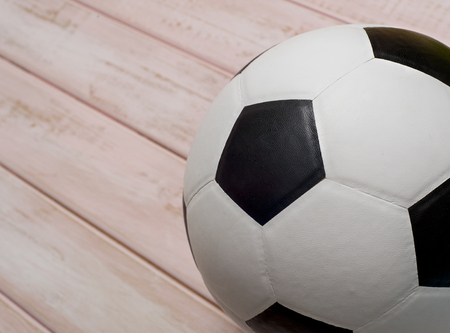 Soccer ball or football on pink wooden floorの写真素材