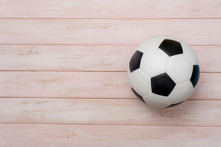 Soccer ball or football on pink wooden floorの写真素材