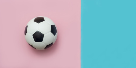 soccer ball or football on pink and blue backgroundの写真素材